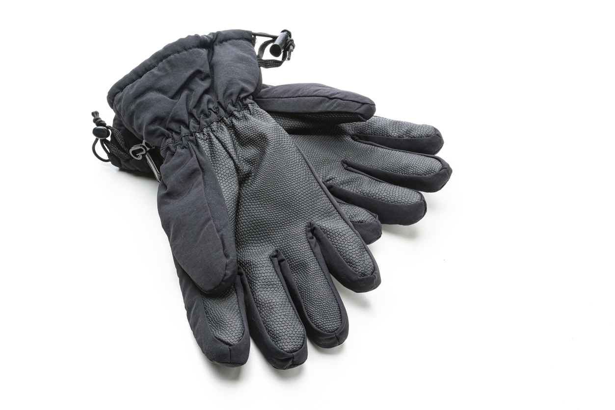 Pair of black winter sport gloves isolated on white background. Copy space